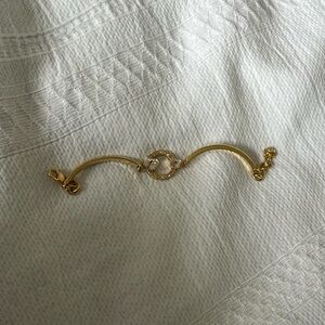 Gold Swarovski bracelet.